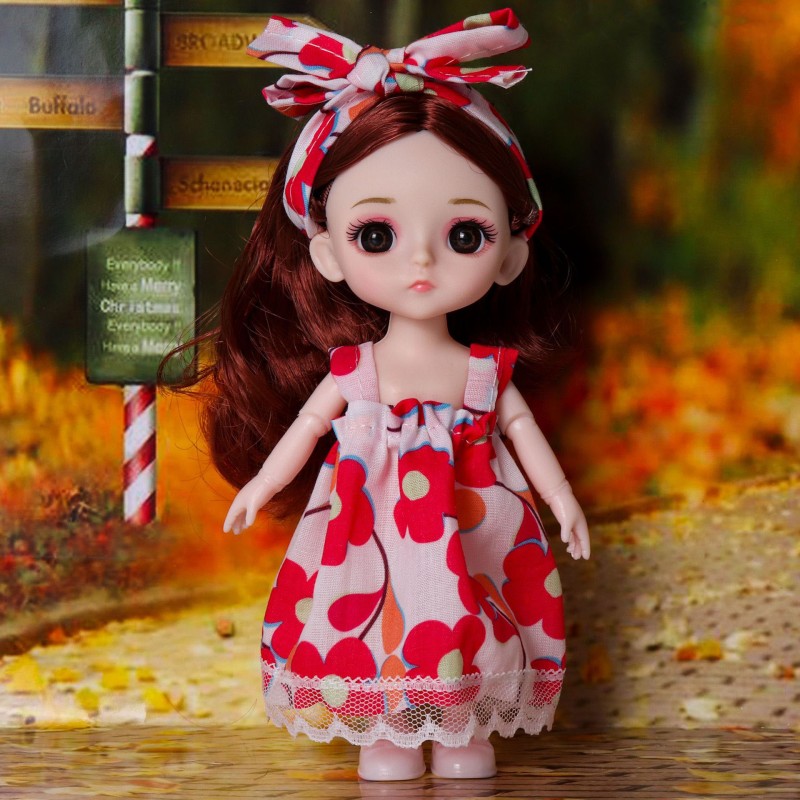 Doll in a summer look with a floral dress and a headband 15 cm